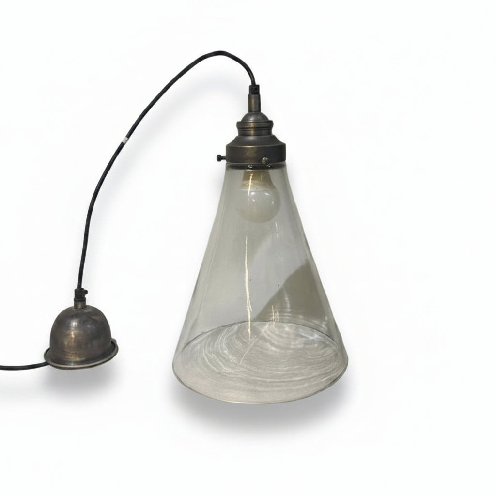 Vintage-style lamp with glass shade on a white surface
