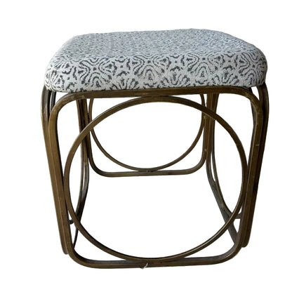 Small foot stool with patterned cushion