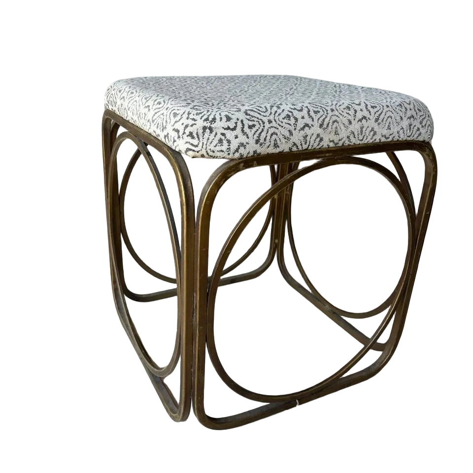 Small foot stool with patterned cushion
