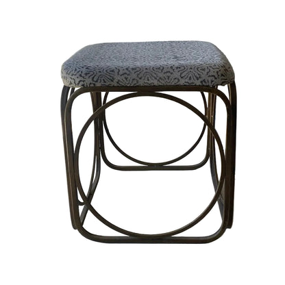 Small foot stool with patterned cushion