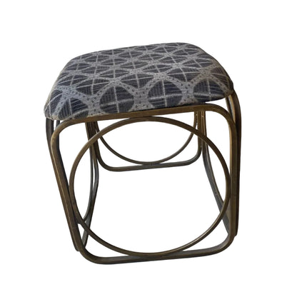 Small foot stool with patterned cushion