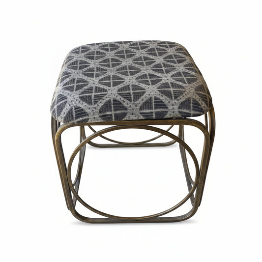 Small foot stool with patterned cushion