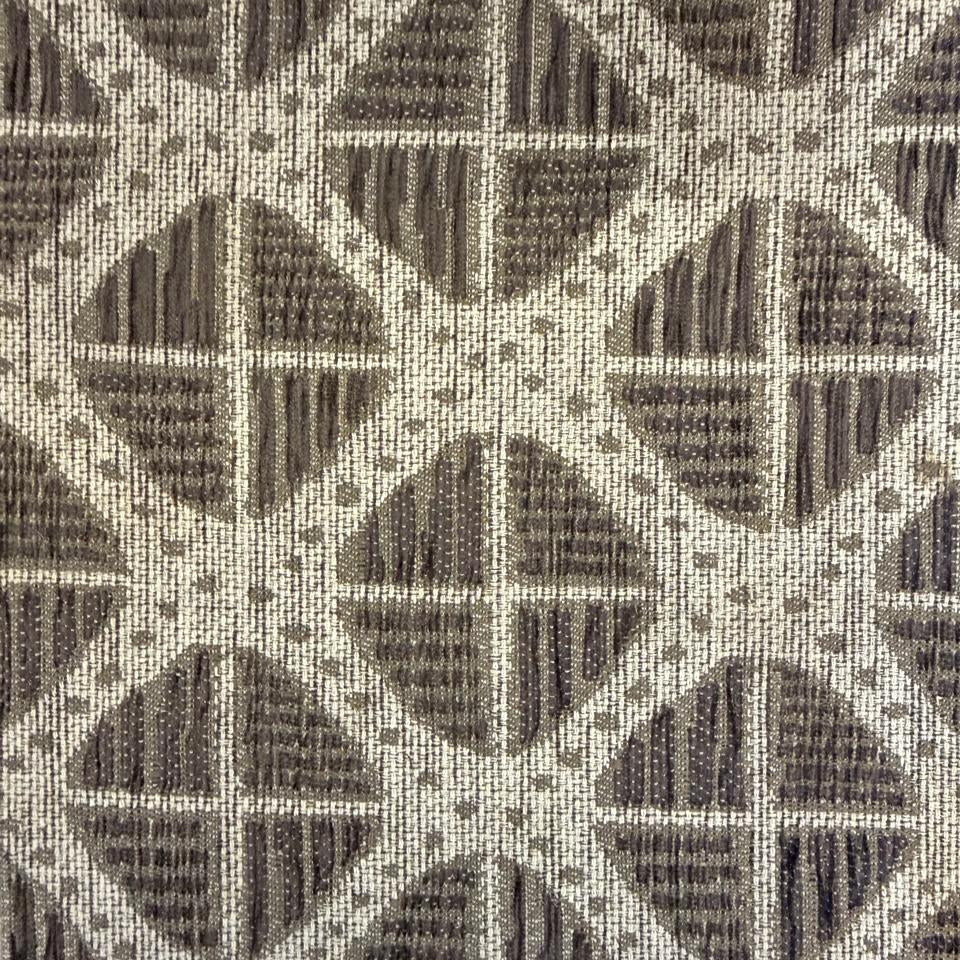 Textured fabric with geometric pattern in brown and beige tones
