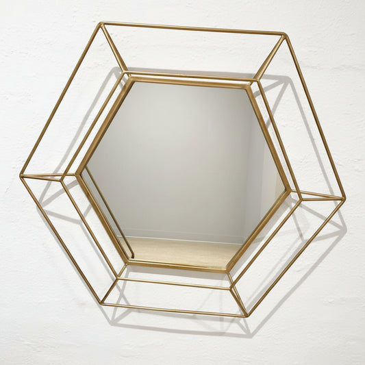 Hexagonal gold-framed mirror
