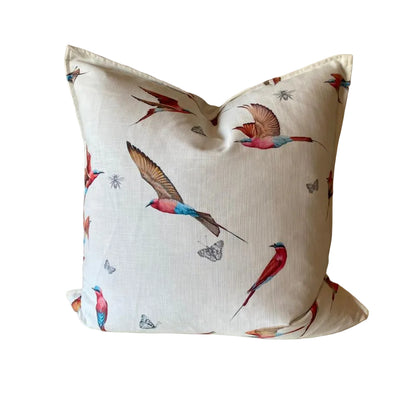 Decorative pillow with bird pattern on a plain background