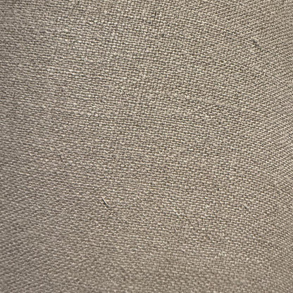 Close-up of a textured beige fabric surface lamp shade